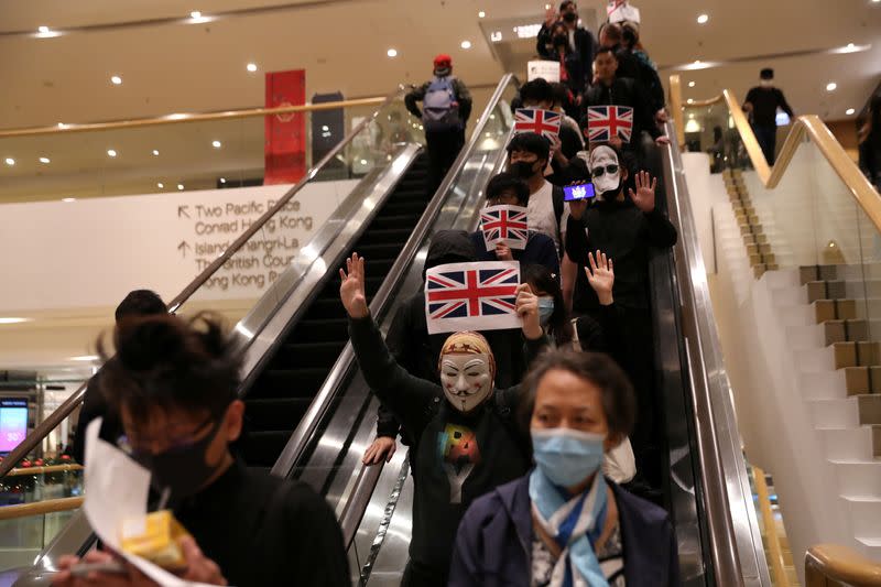 Protestors attend a rally outside the British Consulate General in Hong Kong