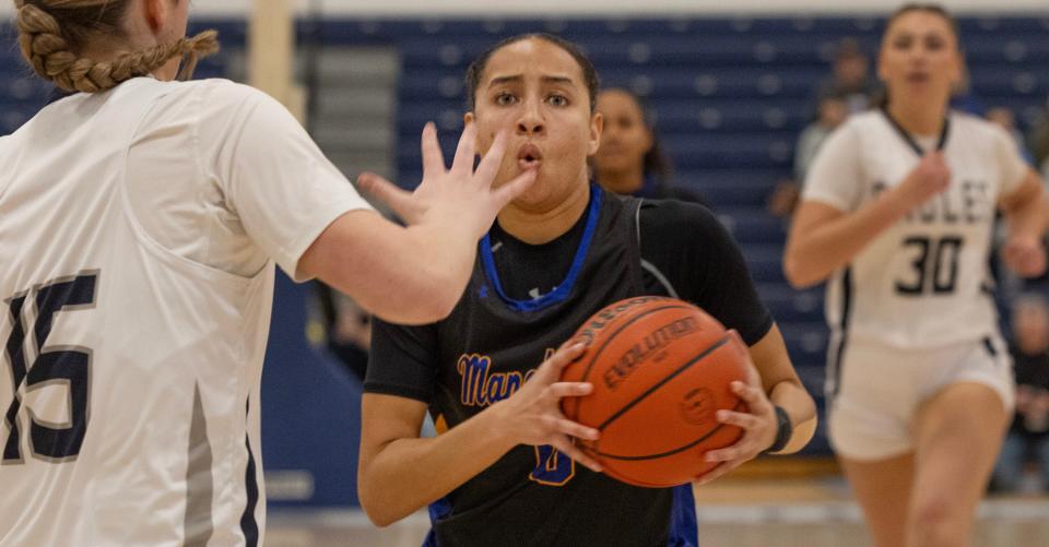 Manchester Devyn Quigley pulls in a loose ball and heads to the basket. Manchester Girls Basketball defeats Middletown South in 2023 WOBM Christmas Tournament opening round in Toms River on December 26, 2023.