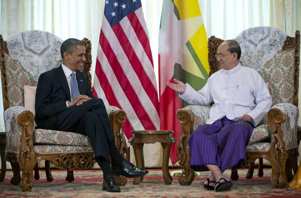 FILE - In this Nov. 19, 2012 file photo, U.S. President Barack Obama, left, meets with Myanmar's President Thein Sein at the Yangon Parliament building in Yangon, Myanmar. The United States is unwinding two decades of sanctions against Myanmar, as the country's reformist leadership oversees rapid-fire economic and political change. Obama's visit this week, the first by a serving U.S. president, is a sign of how far relations have come. But Washington continues to take a calibrated approach to easing sanctions, keen to retain leverage should Myanmar's reform momentum stall. (AP Photo/Carolyn Kaster, File)