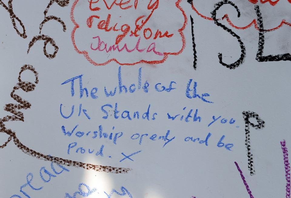 Tributes written by members of the public at the Finsbury Park mosque (PA Images)