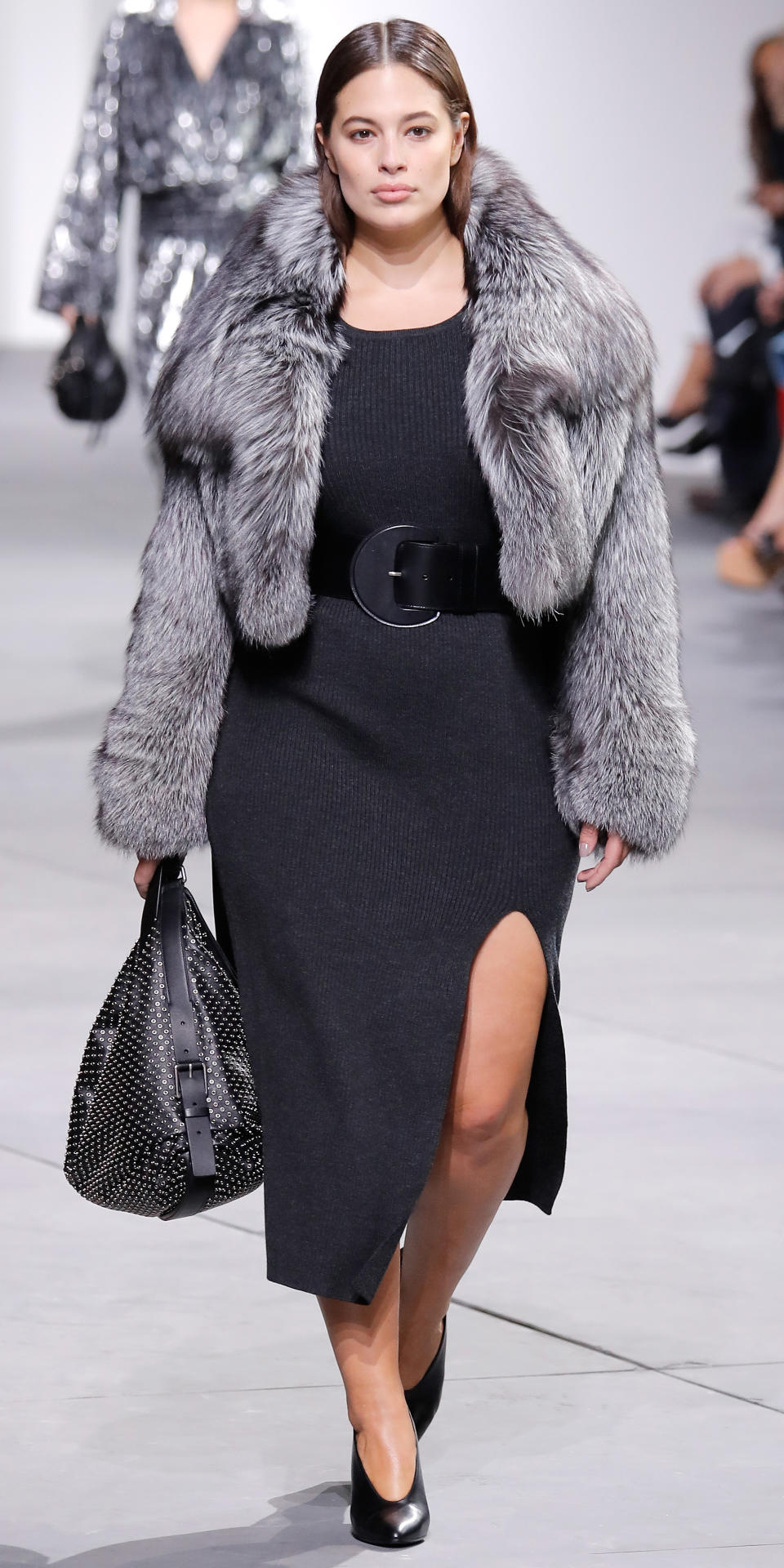 <p>Graham walked Michael Kors in a belted dress with a thigh-high slit and gray fur coat. The 28-year-old's appearance may mark a potential shift for the designer, who had previously never used curvy models in his runway shows.</p>