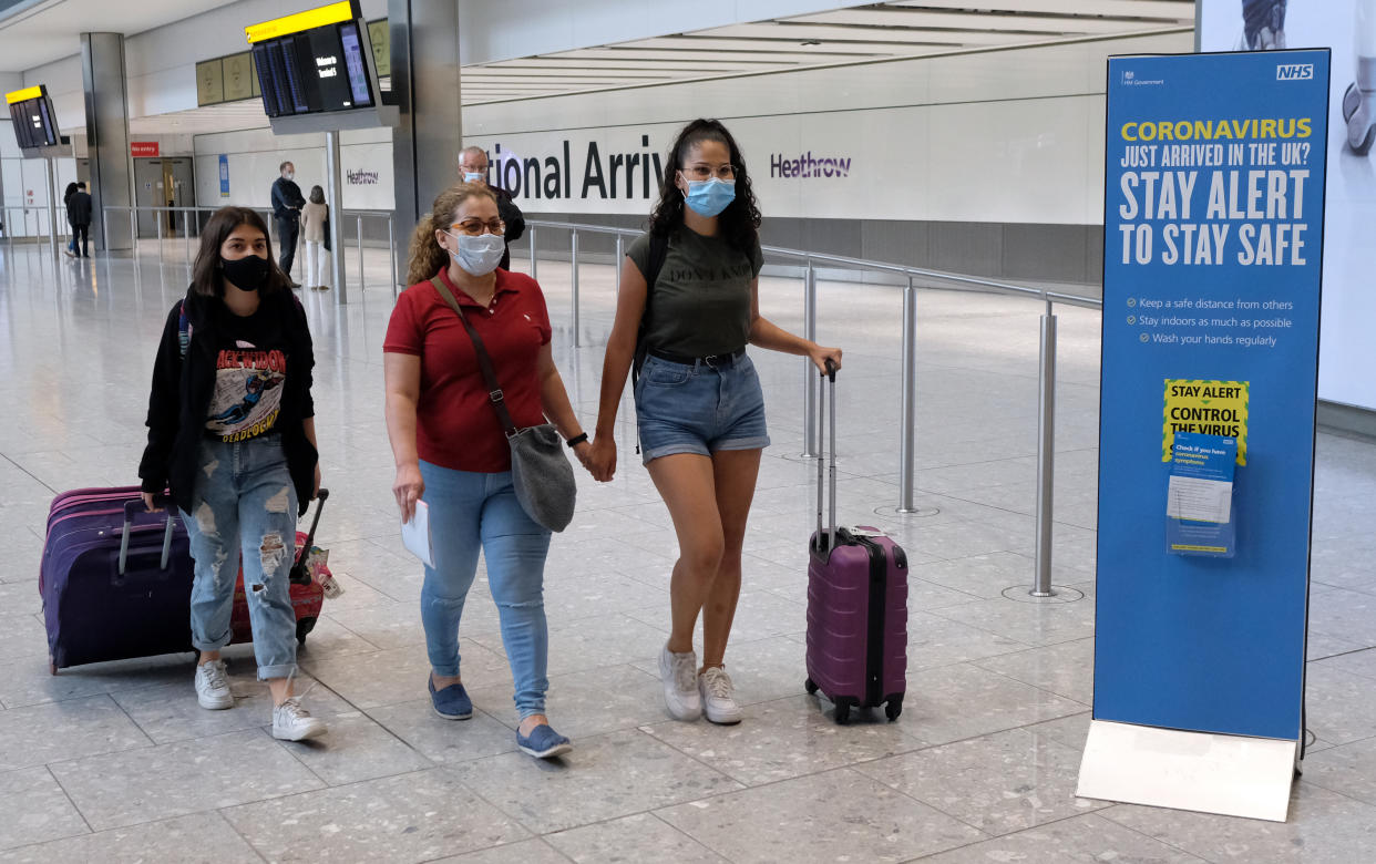 Passengers on a flight from Madrid arrive at Heathrow Airport, following an announcement on Saturday that holidaymakers who had not returned from Spain and its islands by midnight would be forced to quarantine for 14 days after Covid-19 second wave fears saw the European country struck off the UK's safe list. The decision was made after Spain recorded more than 900 fresh daily Covid-19 cases for two days running. (Photo by Andrew Matthews/PA Images via Getty Images)
