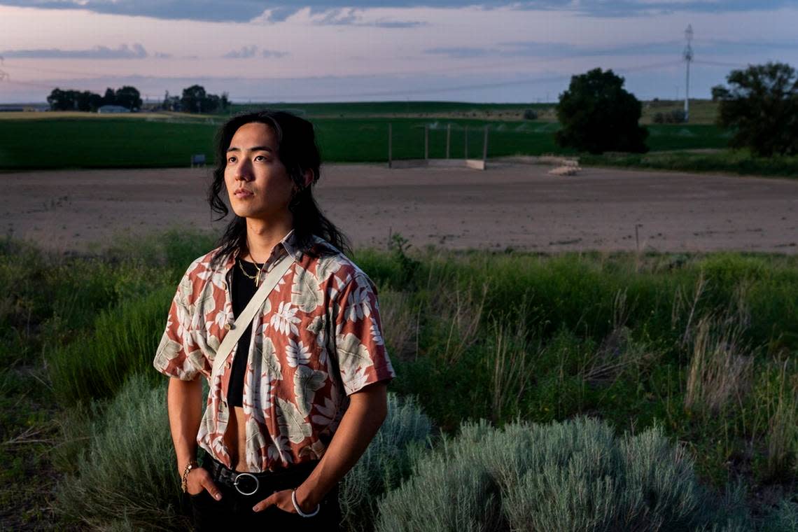 Jonnie Narita, 24, whose grandfather George Nakagawa was a baseball star at the camp, poses for a portrait in front of a recreated baseball diamond at Minidoka National Historic Site in, July.