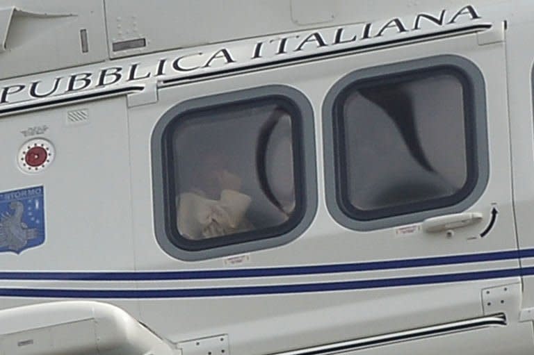 Pope Francis arrives in a helicopter for a meeting with his predecessor Benedict XVI at the papal residence of Castel Gandolfo on March 23, 2013. Pope Francis flew in to a papal residence near Rome on Saturday for an unprecedented encounter with "pope emeritus" Benedict XVI -- the first time a pontiff has met his predecessor