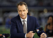 FILE - In this Oct. 30, 2016, file photo, NBC Sunday Night Football cast member Cris Collinsworth sits on the set during pregame of an NFL football game between the Philadelphia Eagles and the Dallas Cowboys in Arlington, Texas. The former receiver moved right to TV after ending his career following the 1988 season working in the studio on HBO's "Inside the NFL." He did both studio work and worked as a game analyst throughout his career but has had his biggest impact on NBC's coverage on Sunday nights a decade ago. (AP Photo/Ron Jenkins, File)