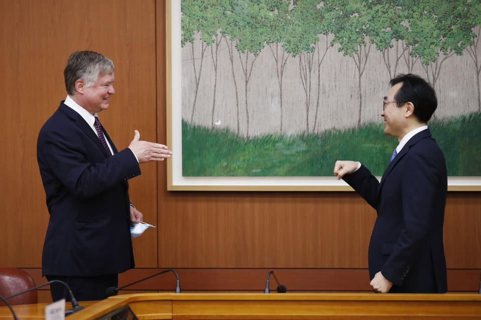 U.S. Deputy Secretary of State Stephen Biegun, left, is greeted by his South Korean counterpart Lee Do-hoon during their meeting at the Foreign Ministry in Seoul Wednesday, July 8, 2020. Biegun is in Seoul to hold talks with South Korean officials about allied cooperation on issues including North Korea. (Kim Hong-ji/Pool Photo via AP)