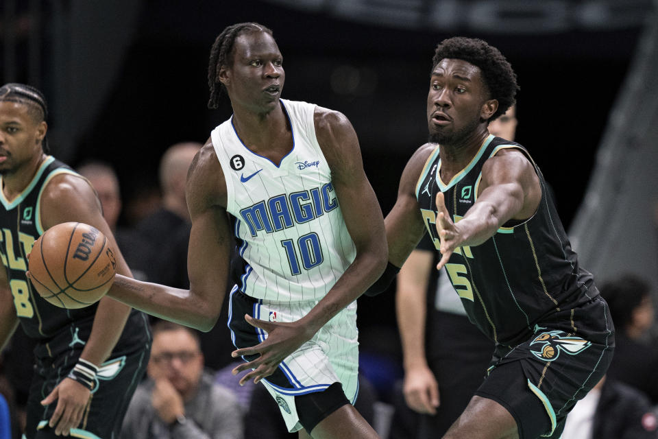 Charlotte Hornets center Mark Williams (5) guards Orlando Magic center Bol Bol (10) during the first half of an NBA basketball game in Charlotte, N.C., Sunday, Feb. 5, 2023. (AP Photo/Jacob Kupferman)