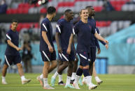 France's Antoine Griezmann, front right, and his teammates walk on the pitch during a team training session at Allianz Arena stadium in Munich, Monday, June 14, 2021 the day before the Euro 2020 soccer championship group F match between France and Germany. (AP Photo/Matthias Schrader)