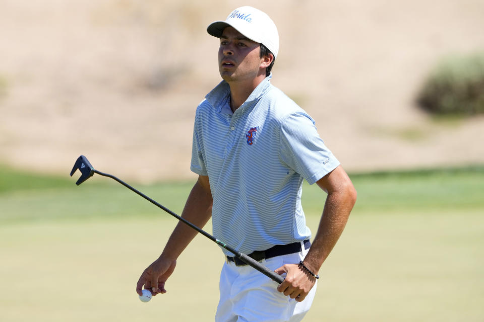 Florida golfer Fred Biondi walks off the second green during the final round of the NCAA college men's match play golf championship, Wednesday, May 31, 2023, in Scottsdale, Ariz. (AP Photo/Matt York)