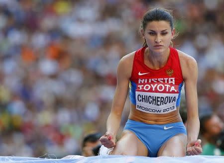 Anna Chicherova of Russia reacts after successfully clearing the bar during the women's high jump final at the IAAF World Athletics Championships at the Luzhniki stadium in Moscow August 17, 2013. REUTERS/Dominic Ebenbichler