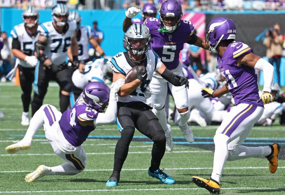 Carolina Panthers wide receiver Adam Thielen, center, attempts to avoid the collapsing Minnesota Vikings defense following a pass reception during second quarter action at Bank of America Stadium on Sunday, October 1, 2023. JEFF SINER/jsiner@charlotteobserver.com