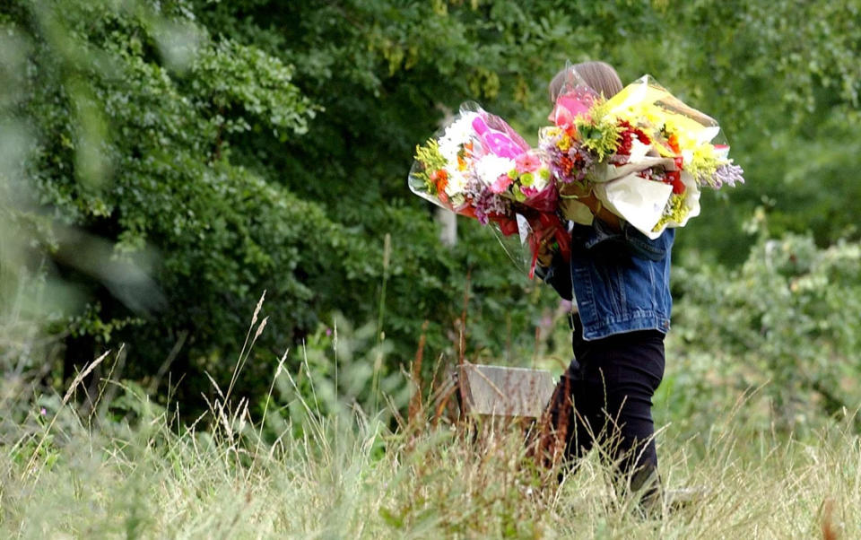 Flowers being delivered to the scene in Ashford, Kent, where police are hunting for the killer of 21-year-old Amanda Champion. Amanda's body was found at the weekend in the Willesborough area of Ashford. Police today identified her as they tried to piece together her last movements.  