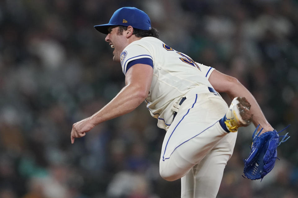 Seattle Mariners starting pitcher Robbie Ray follows through on a pitch to Oakland Athletics' Elvis Andrus that resulted in a solo home run during the seventh inning of a baseball game, Sunday, July 3, 2022, in Seattle. AP Photo/Ted S. Warren)