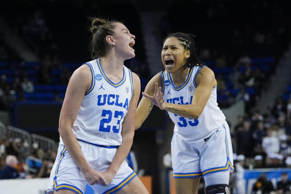 UCLA forward Gabriela Jaquez celebrates with guard Camryn Brown after drawing a foul against Cal Baptist.