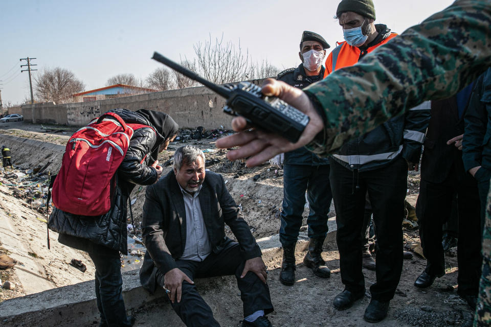 08 January 2020, Iran, Shahedshahr: A man cries at the scene, where a Ukrainian airplane carrying 176 people crashed on Wednesday shortly after takeoff from Tehran airport, killing all onboard. Photo: Foad Ashtari/dpa (Photo by Foad Ashtari/picture alliance via Getty Images)