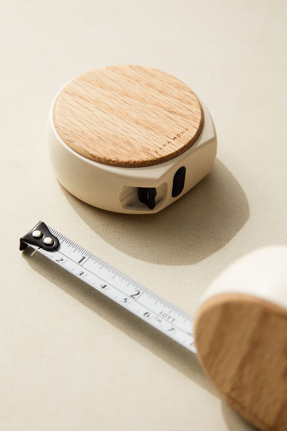 <p>Getting the exact measurements is essential for any DIY job, so do it in style with this beech wood measuring tape with a cream finish. Measuring up to two metres, it holds at the desired measurement and has an automatic locking system.</p>