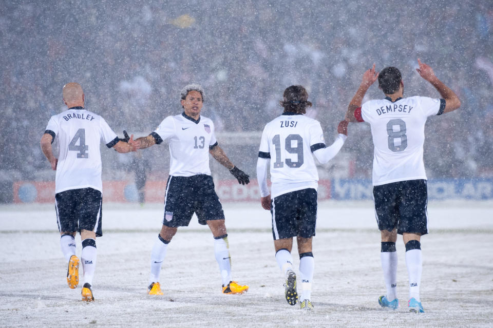 COMMERCE CITY, CO - MARCH 22:  Midfielder Clint Dempsey #8 of the United States celebrates a goal with teammates, (L - R) Michael Bradley, Jermaine Jones, and Graham Zusi during a FIFA 2014 World Cup Qualifier match against Costa Rica at Dick's Sporting Goods Park on March 22, 2013 in Commerce City, Colorado. (Photo by Dustin Bradford/Getty Images)