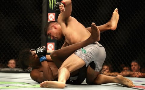 Vicente Luque punches Jalin Turner on his way to a KO in their welterweight bout - Credit: Christian Petersen/Zuffa LLC