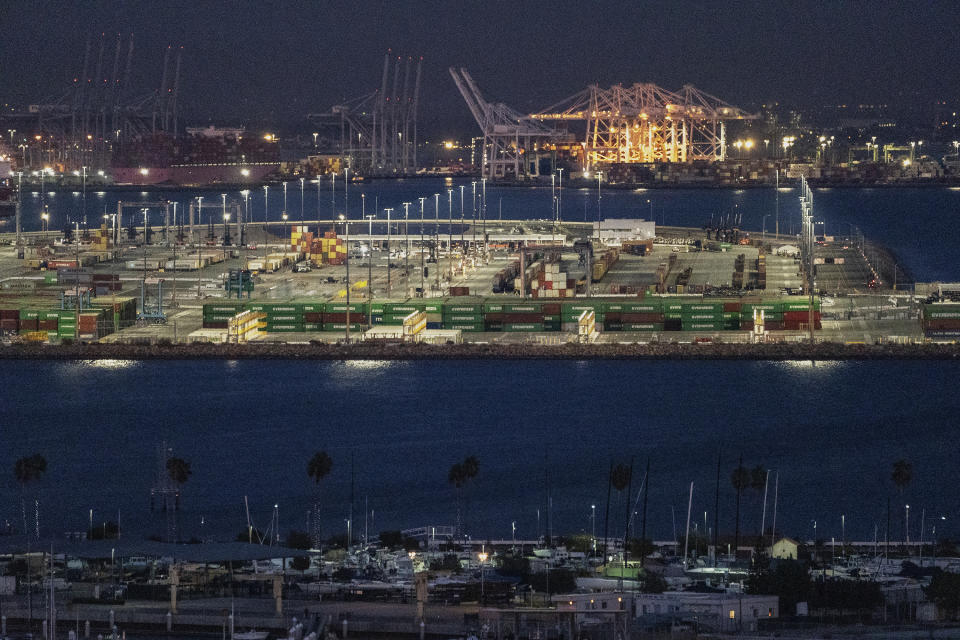 FILE - Loading docks are seen at the Port of Los Angeles, on Monday, Nov. 21, 2022. A year ago, Los Angeles and Shanghai formed a partnership to create a green shipping corridor that would become a showcase for slashing planet-warming carbon emissions from the shipping industry, which produces about 3% of the world's total. The container shipping route is among the world’s busiest. (AP Photo/Damian Dovarganes, File)