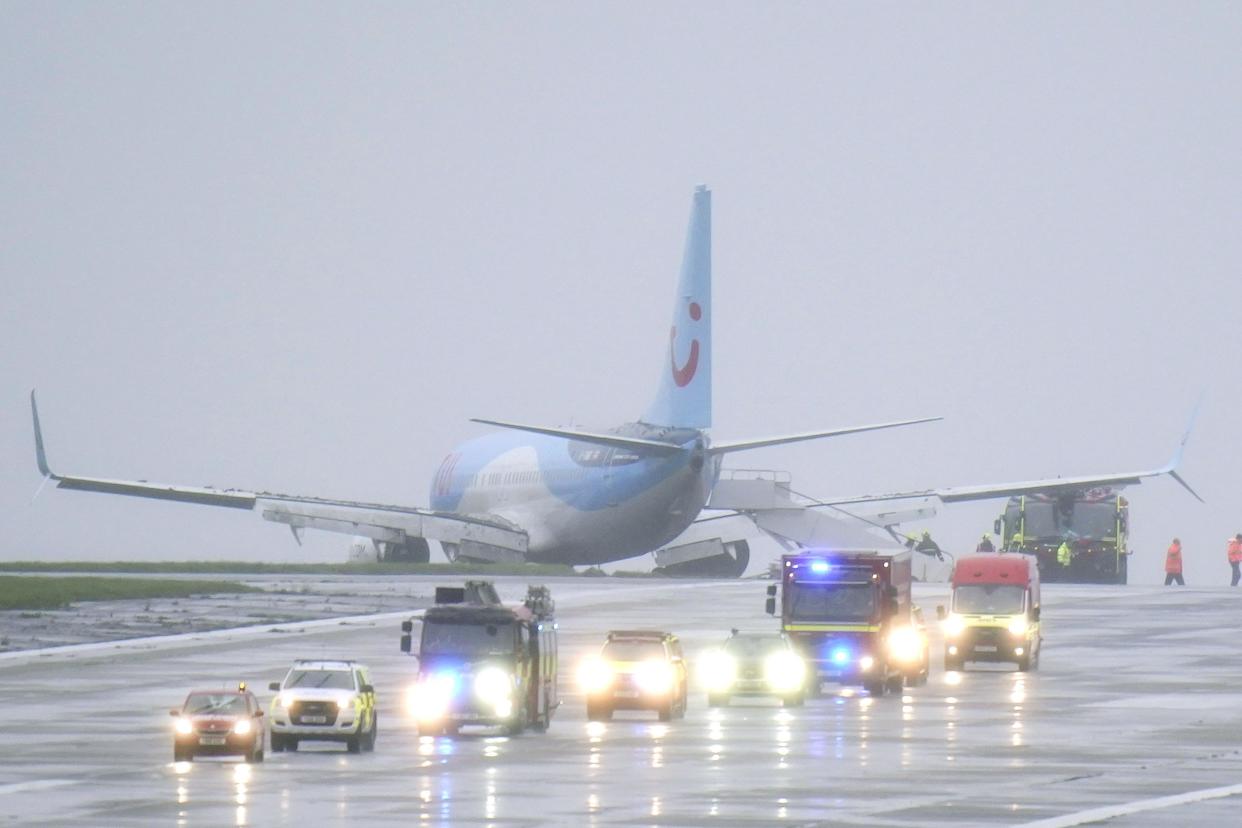 Emergency services at the scene after a passenger plane came off the runway at Leeds Bradford Airport while landing in windy conditions during Storm Babet (PA Wire)