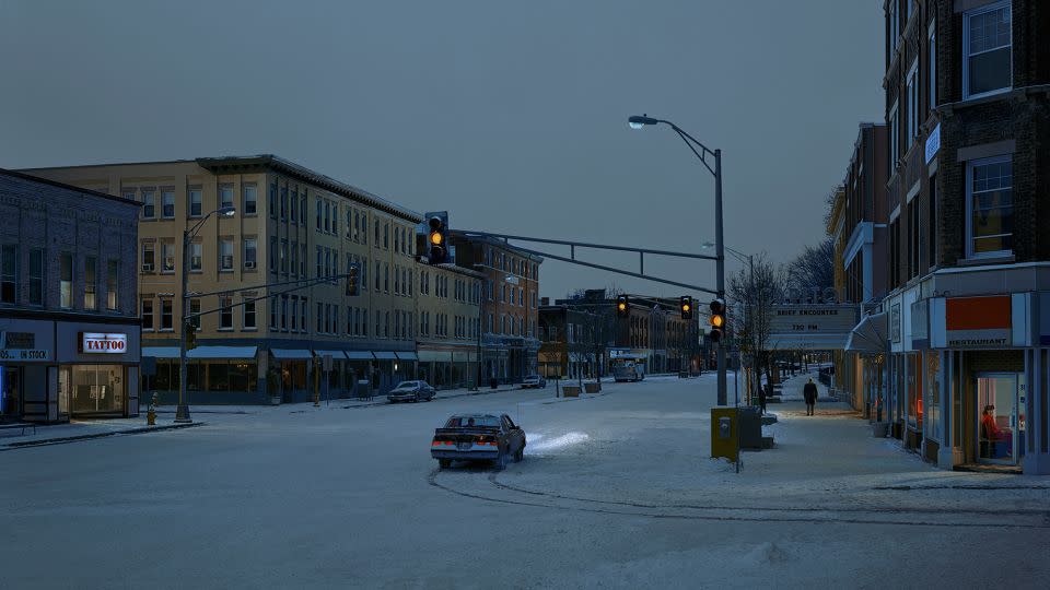 “Beneath the Roses” took eight years to complete during a period when photography was rapidly changing from film to digital. The body of work “was the first time we really started working like a movie... it felt much more organized,” Crewdson said. For this snowy nighttime scene in Pittsfield, his studio received permission to close down the street; the photographer changed the theater marquee to read “Brief Encounter,” referring to the scenes small figures in the scene. - Gregory Crewdson