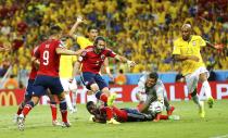 Colombia's Mario Yepes (3) scores a goal, which was later declared offside, during the 2014 World Cup quarter-finals between Brazil and Colombia at the Castelao arena in Fortaleza July 4, 2014. REUTERS/Marcelo Del Pozo (BRAZIL - Tags: TPX IMAGES OF THE DAY SOCCER SPORT WORLD CUP)