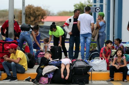 Venezuelan migrants wait at the Binational Border Service Center of Peru, in Tumbes