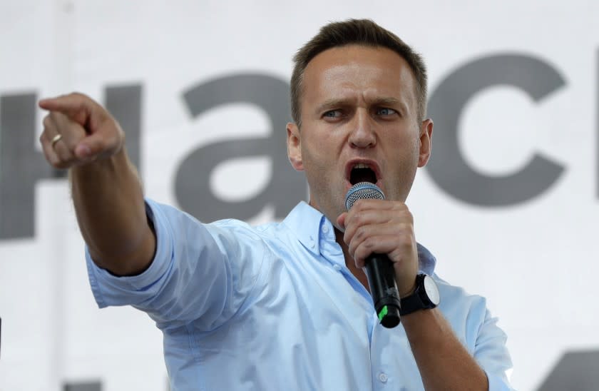 FILE - In this file photo taken on Saturday, July 20, 2019, Russian opposition activist Alexei Navalny gestures while speaking to a crowd during a political protest in Moscow, Russia. Russian doctors treating opposition politician Alexei Navalny say they haven't found any indication that the Kremlin critic was poisoned. Deputy chief doctor Anatoly Kalinichenko at Omsk hospital says that as of today, no traces of poison were found in Navalny's body. Navalny spokeswoman Kira Yarmysh posted a video on Twitter of Kalinichenko speaking. (AP Photo/Pavel Golovkin, File)