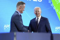 President Joe Biden shakes hands after Golden State Warriors head basketball coach Steve Kerr introduced him at a welcome reception for Asia-Pacific Economic Cooperative leaders at the Exploratorium, in San Francisco, Wednesday, Nov, 15, 2023. (Doug Mills/The New York Times via AP, Pool)