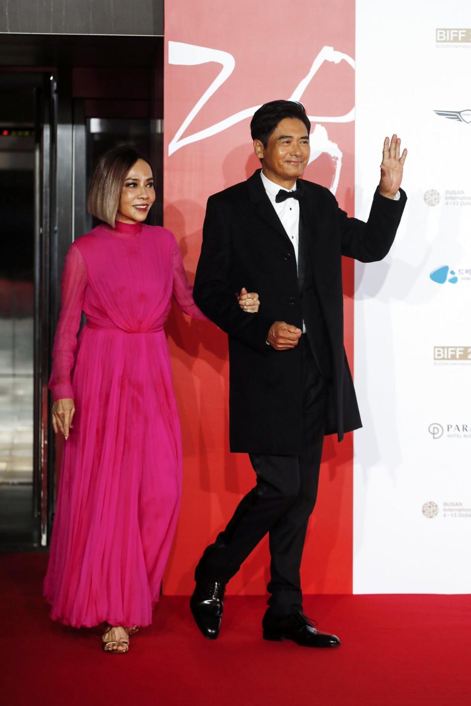 BUSAN, SOUTH KOREA - OCTOBER 04: Chow Yun Fat, Jasmine Chow and Anthony Pun arrive for the Opening Ceremony of the 28th Busan International Film Festival at Busan Cinema Center on October 04, 2023 in Busan, South Korea. (Photo by Woohae Cho/Getty Images)