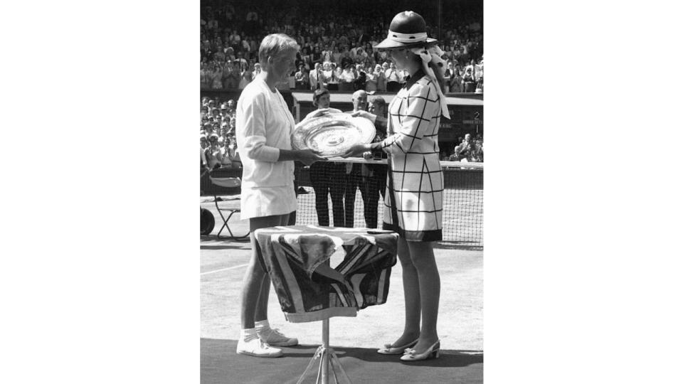  English tennis player Ann Jones (nee Haydon) being presented with the trophy by Princess Anne after beating Billie Jean King of the USA