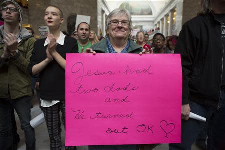 Mary Beth Keidl holds a sign during a rally supporting same-sex marriage at the state capitol in Salt Lake City, Utah January 10, 2014. REUTERS/Sallie Dean Shatz