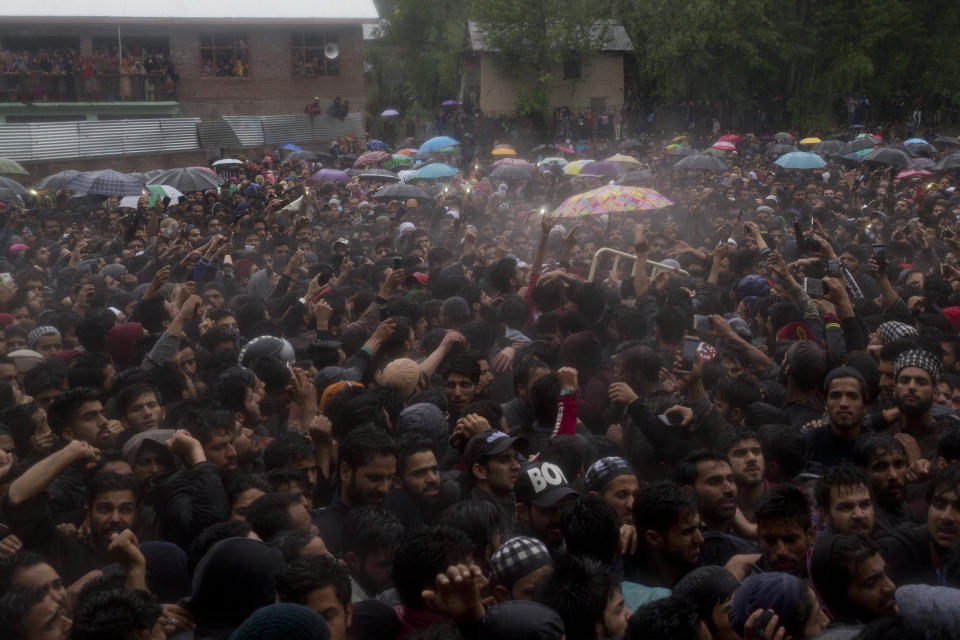 Kashmiri villagers carry the body of Zakir Musa, a top militant commander linked to al-Qaida, as it rains during his funeral procession in Tral, south of Srinagar, Indian controlled Kashmir, Friday, May 24, 2019. Musa was killed Thursday evening in a gunfight after police and soldiers launched a counterinsurgency operation in the southern Tral area, said Col. Rajesh Kalia, an Indian army spokesman. (AP Photo/Dar Yasin)