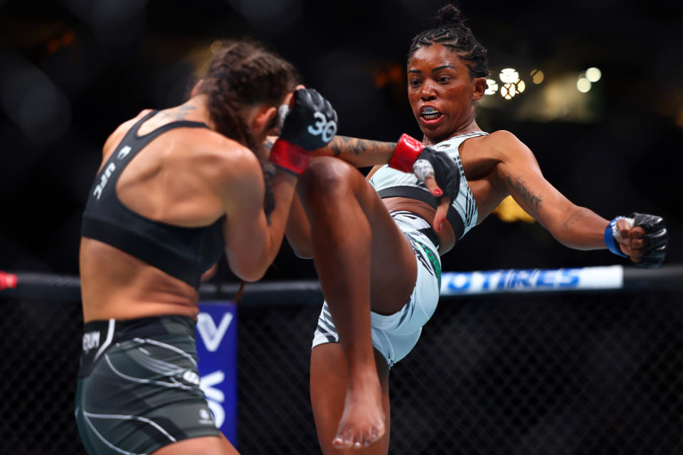 Jun 10, 2023; Vancouver, BC, Canada; Maria Oliveira moves in with a knee hit against Diana Belbita during UFC 289 at Rogers Arena. Mandatory Credit: Sergei Belski-USA TODAY Sports