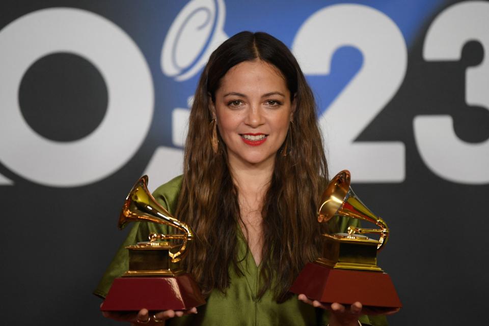 Mexican singer Natalia Lafourcade poses with her awards for best song and best album.