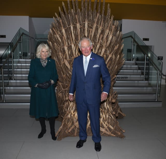 Charles and Camilla view a throne made for the party at the end of filming of Game of Thrones by local man Bob Johnson. Ian Vogler/Daily Mirror