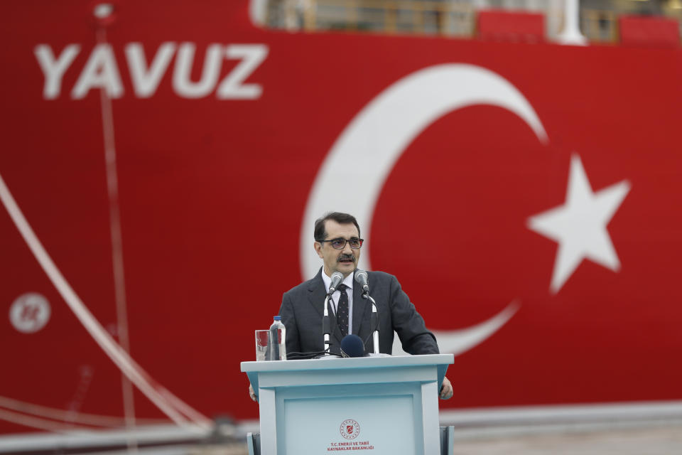 Turkish Energy and Natural Resources Minister Fatih Donmez talks during a ceremony to launch the 230-meter (750-foot) drillship 'Yavuz' to be dispatched to the Mediterranean, at the port of Dilovasi, outside Istanbul, Thursday, June 20, 2019. Turkey had launched Yavuz, that it says will drill for gas off neighbouring Cyprus despite European Union warnings to refrain from such illegal actions that could incur sanctions against Ankara. (AP Photo/Lefteris Pitarakis)