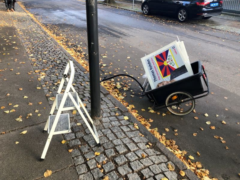 FILE PHOTO: A trolley of a political candidate in upcoming local elections Thomas Rohden loaded with posters displaying him next to a Tibetan flag parks outside the Chinese embassy near Copenhagen