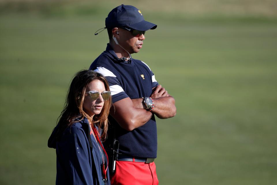 Tiger Woods and his then girlfriend Erica Herman, watch play during the 2017 Presidents Cup.