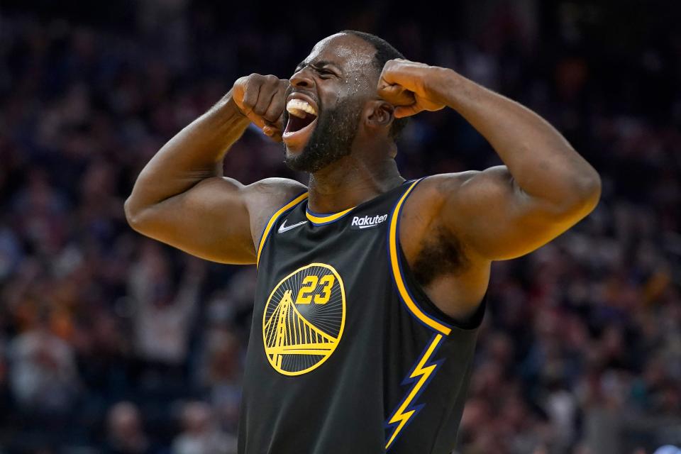 Golden State Warriors forward Draymond Green celebrates during the second half of an NBA basketball game against the Charlotte Hornets in San Francisco, Wednesday, Nov. 3, 2021. (AP Photo/Jeff Chiu).