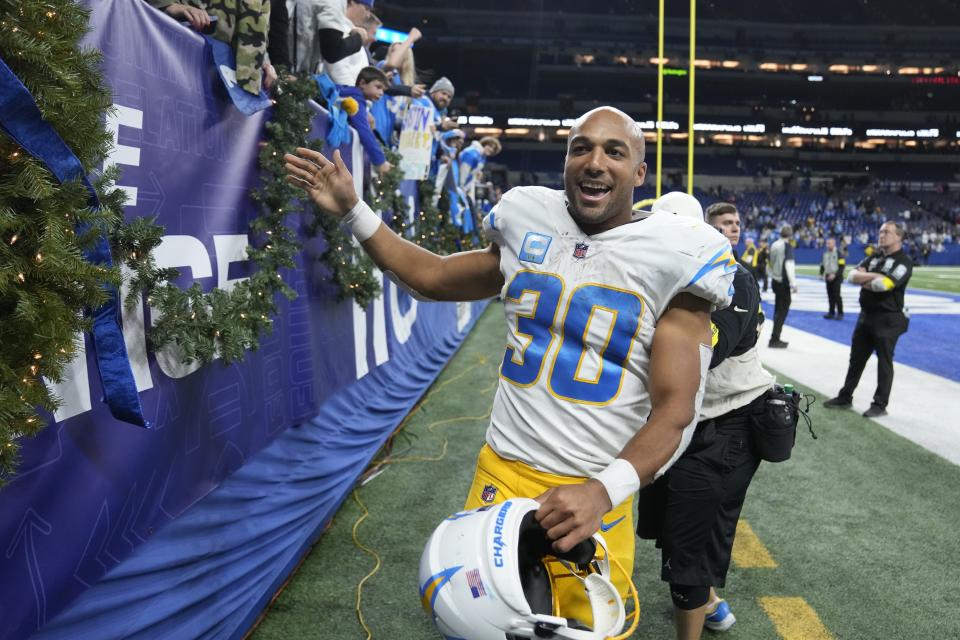 Los Angeles Chargers' Austin Ekeler celebrates following an NFL football game against the Indianapolis Colts, Monday, Dec. 26, 2022, in Indianapolis. (AP Photo/Michael Conroy)