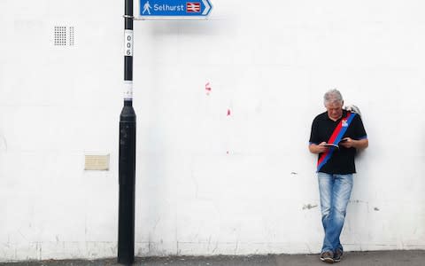 a Palace fan ahead of the Liverpool match - Credit: Reuters