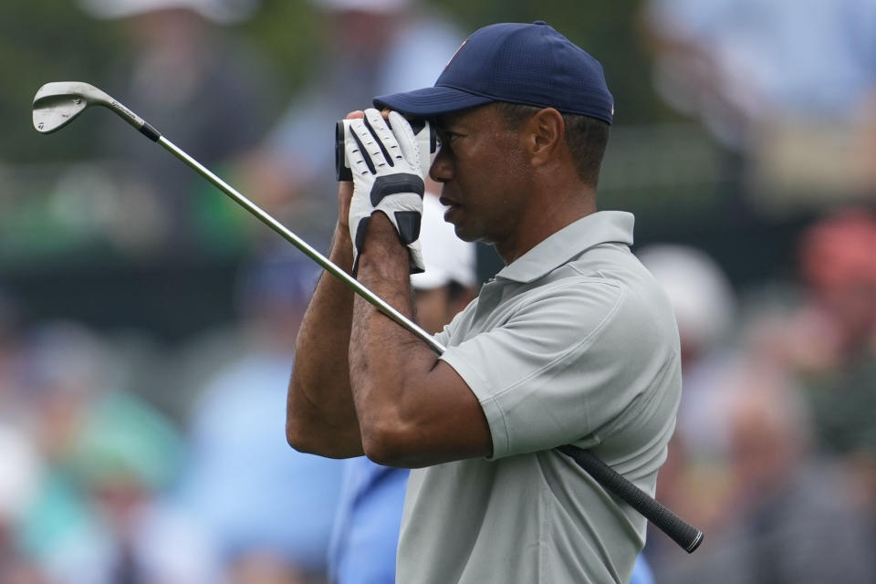Tiger Woods works out on the range during a practice for the Masters golf tournament at Augusta National Golf Club, Tuesday, April 4, 2023, in Augusta, Ga. (AP Photo/Matt Slocum)