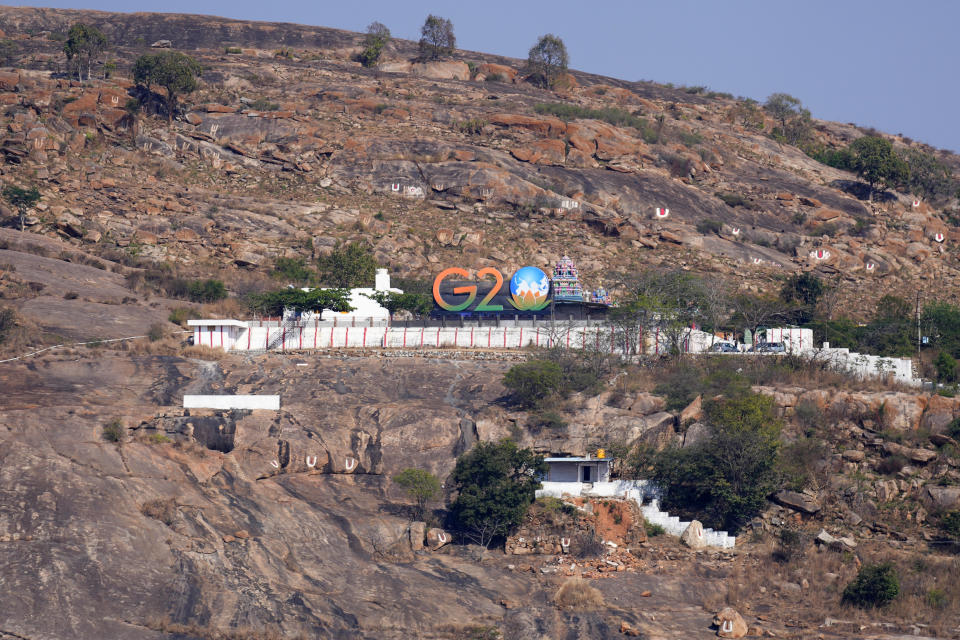 G-20 signage is displayed on a hillock near the venue of G-20 financial conclave on the outskirts of Bengaluru, India, Wednesday, Feb. 22, 2023. Top financial leaders from the Group of 20 leading economies are gathering in the south Indian technology hub of Bengaluru to tackle challenges to global growth and stability. India is hosting the conclave for the first time in 20 years. (AP Photo/Aijaz Rahi)