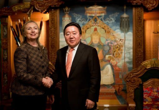 US Secretary of State Hillary Clinton (L) shakes hands with Mongolian President Tsakhia Elbegdorj at the President's Yurt in Ulan Bator on July 9. Clinton arrived in Mongolia as part of an Asian tour aimed at promoting democracy, as local politicians were locked in dispute over recent elections