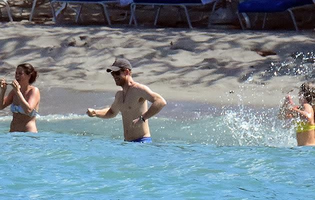 The prince splashed about in the water with two of his friends. Photo: MEGA
