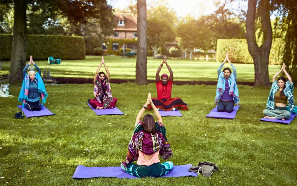 yoga instructor and students - Getty