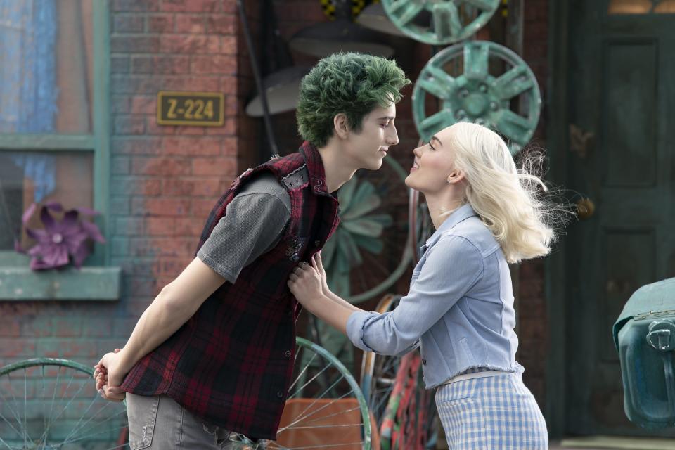 Undead Zed (Milo Manheim) and cheerleader girlfriend Addison (Meg Donnelly) ponder the future as a mysterious band of aliens invade town in Disney+'s "Zombies 3."