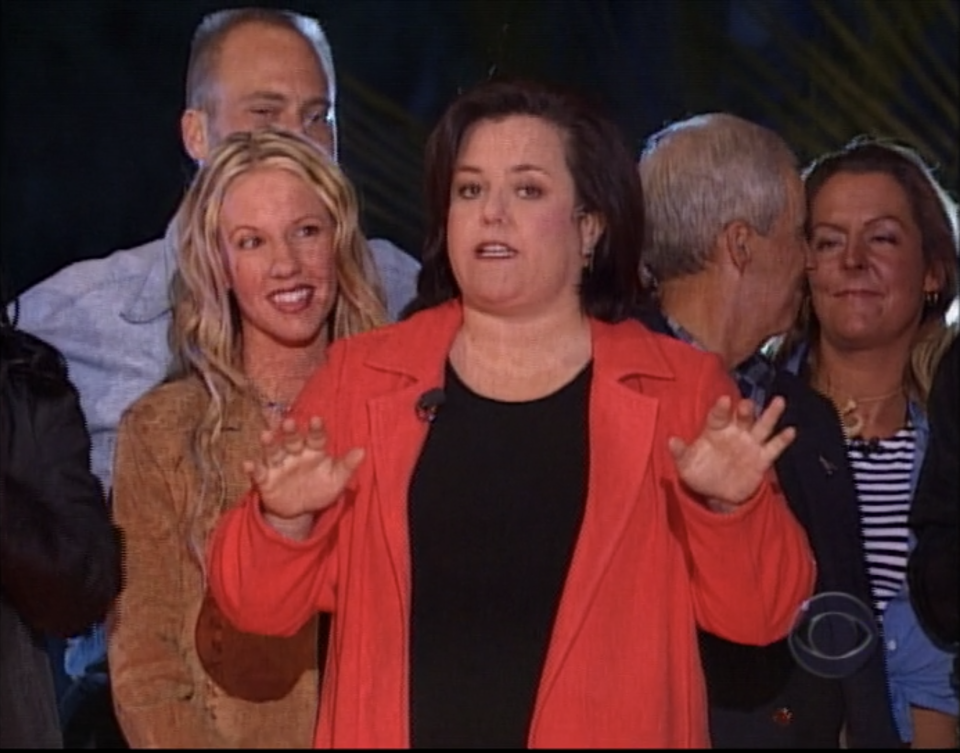 Rosie O'Donnell stands in front of castaways at the Survivor: Marquesas reunion