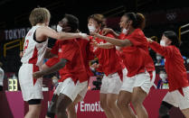 Japan's Maki Takada, left, celebrates with teammates after their win over Belgium in a women's basketball quarterfinal game at the 2020 Summer Olympics, Wednesday, Aug. 4, 2021, in Saitama, Japan. (AP Photo/Eric Gay)